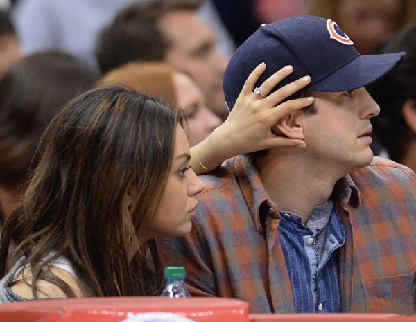 Mila Kunis and Ashton Kutcher at the Clippers v Pistons, game at the Staples Center in Los Angeles, CA