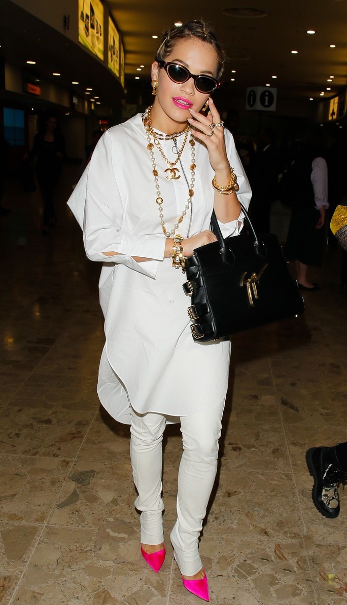 Rita Ora makes a happy landing at Heathrow **USA ONLY**