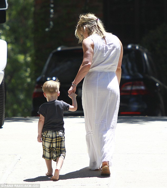 Hilary Duff Carries Package in Ancient Greek Sandals' 'Eleftheria' Flats