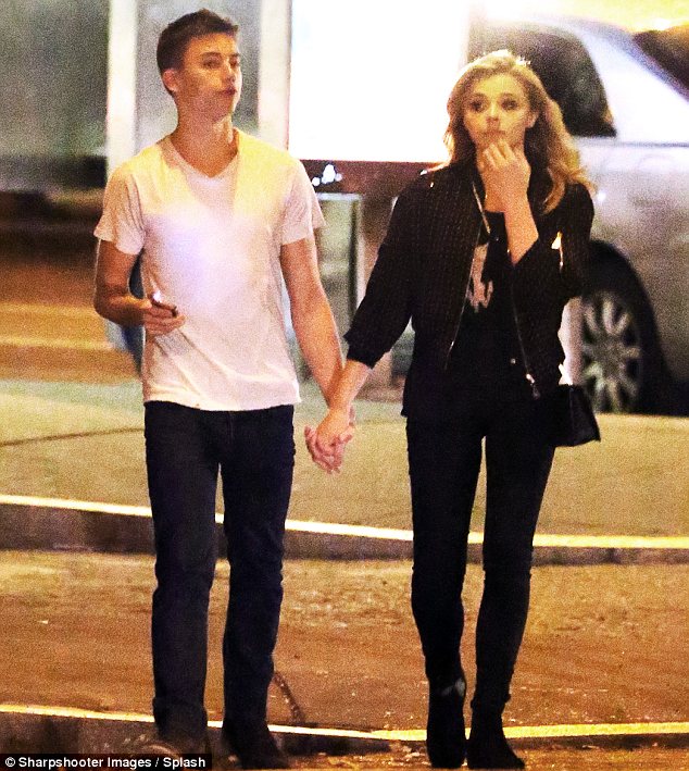 chloe moretz julian moraes hold hands saint laurent boots