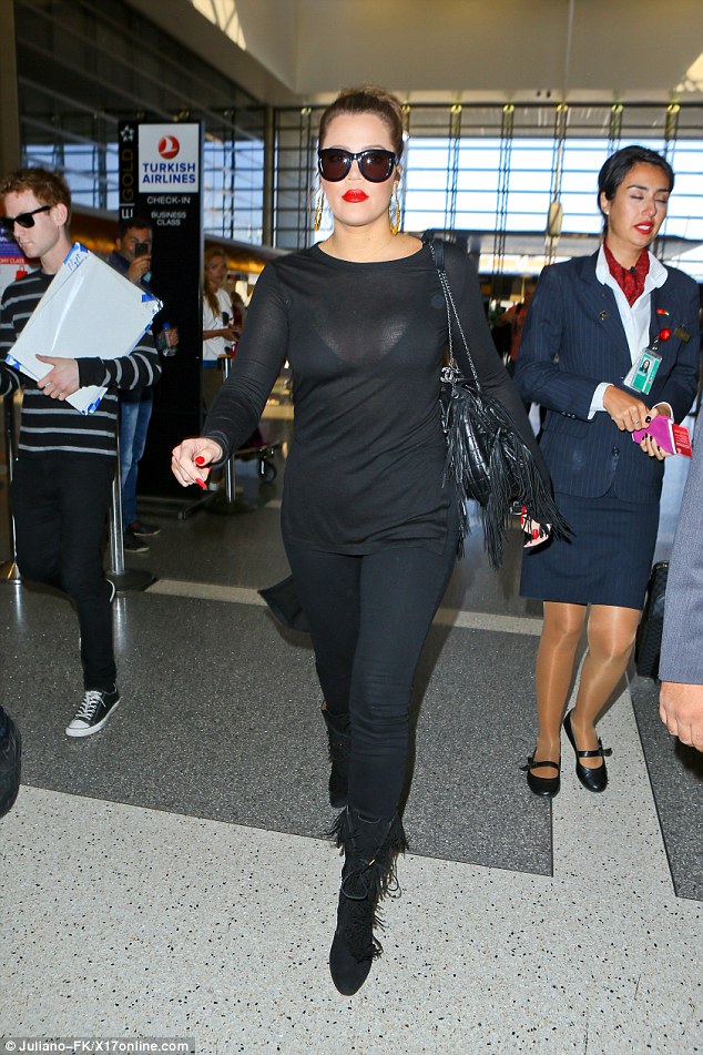 khloe kardashian fringe bag boots airport style 5