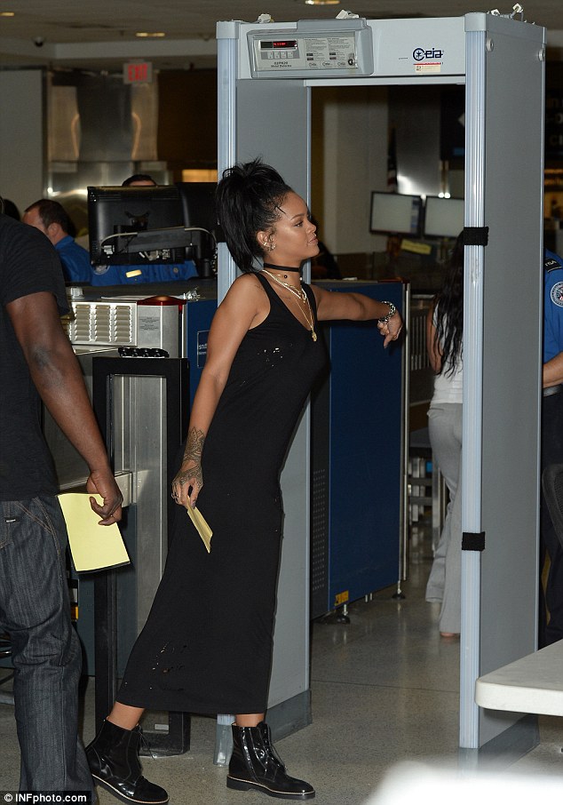 rihanna handgun clutch patent boots black dress airport style 2014 5