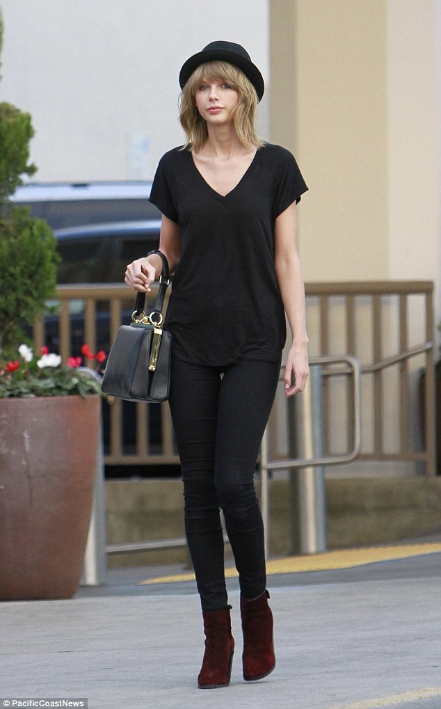 taylor swift all black attire red boots hat 2