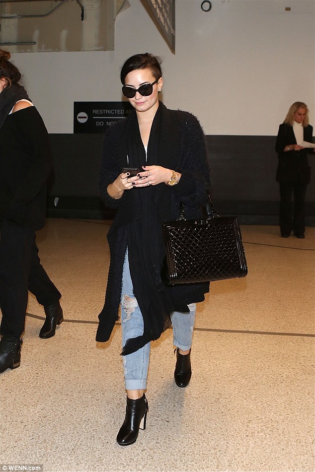 demi lovato ankle boots airport 2