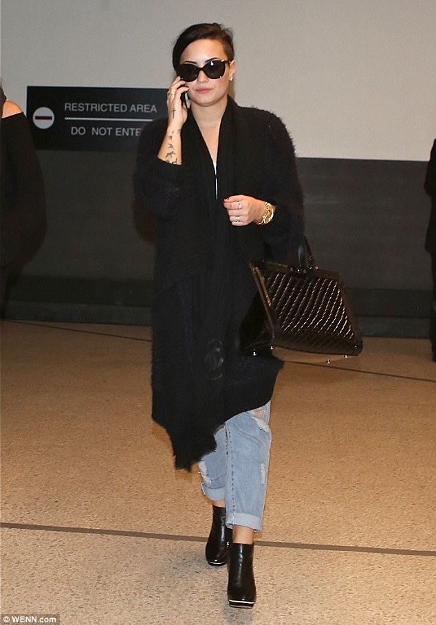 demi lovato ankle boots airport