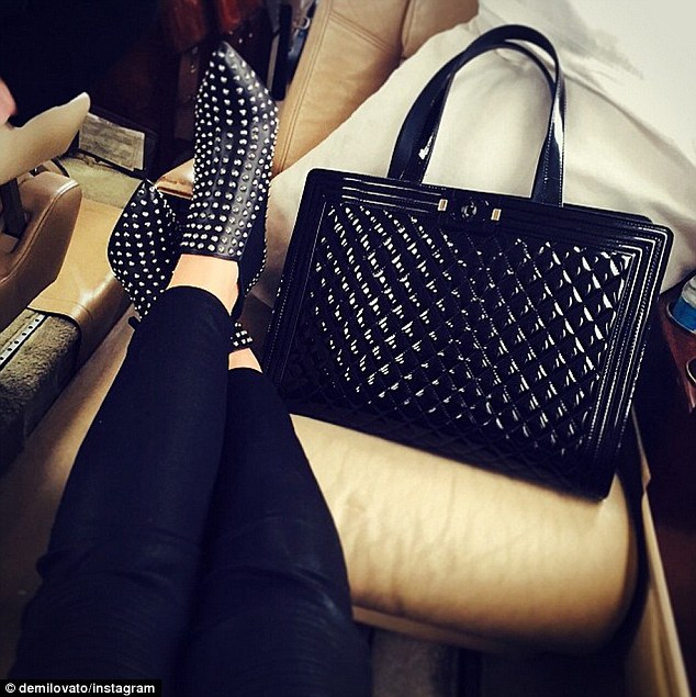demi lovato studded boots quilted bag