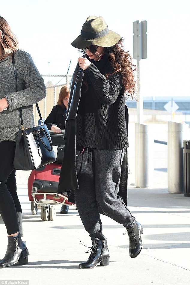 selena gomez track pants boots black outfit december 2014 3
