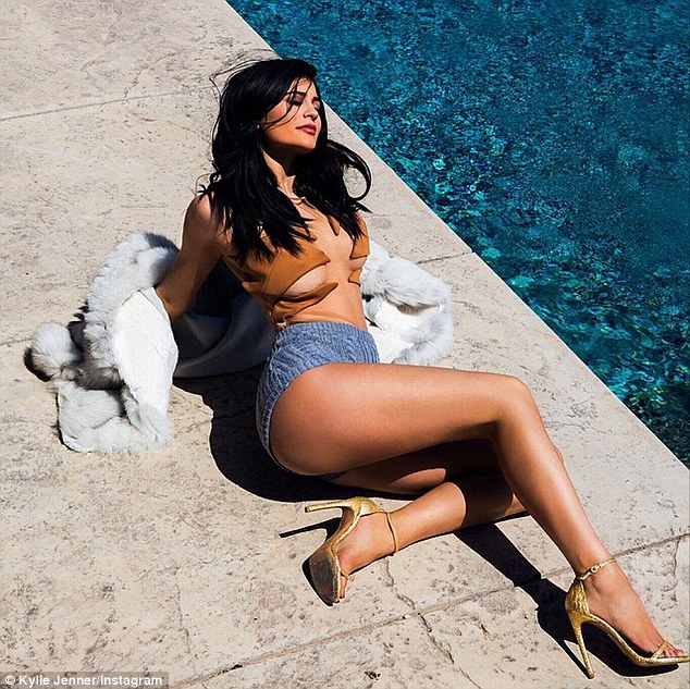 Kylie Jenner Exposes Legs and Breasts While Decked in Gold Heels