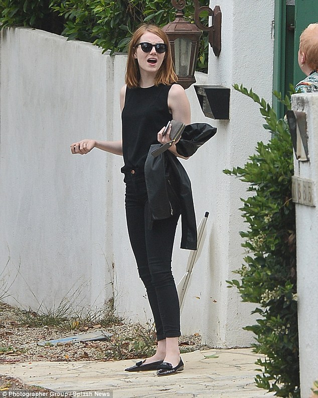 Emma Stone keeps a low profile in a black blazer and matching