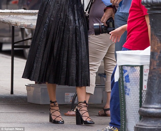 hailey baldwin photo shoot black leather pleated skirt and lace up pumps