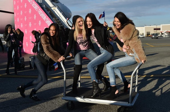 NEW YORK, NY - NOVEMBER 27:  (L-R) Victoria's Secret models Joan Smalls, Lily Donaldson, Bella Hadid and Kendall Jenner depart for Paris for the 2016 Victoria's Secret Fashion Show on November 27, 2016 in New York City.  (Photo by Mike Coppola/Getty Images for Victoria's Secret)