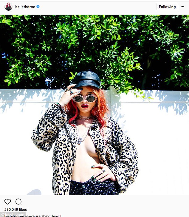 Bella Thorne woe no top and bra to pose in a leopard-print fur