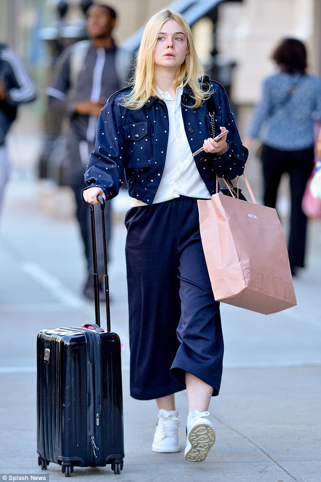 Elle Fanning looks chic in casual looks in navy culottes and a striking  polka dot jacket – Shoes Post